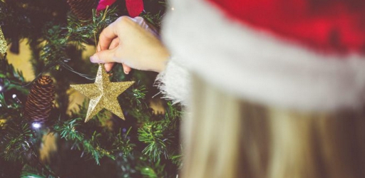 young-woman-decorating-a-christmas-tree-picjumbo-com-e1510922575471